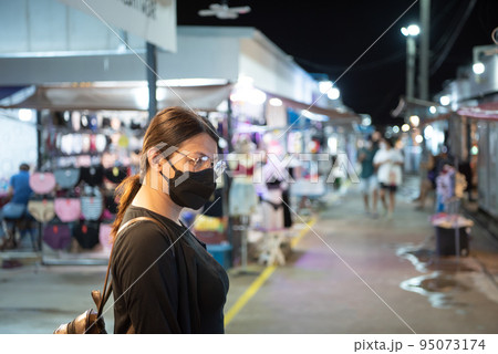 Woman (LGBTQ) posing with food at thai street food 95073174