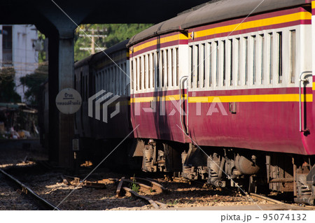 Thai railway train with locomotive runs in Bangkok Thai railway train with locomotive runs in Bangkok 95074132