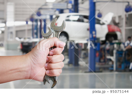 Hand of professional Auto mechanic with wrench Hand of professional Auto mechanic with wrench 95075144