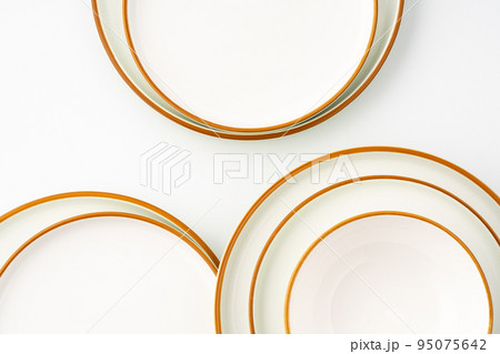 A set of ceramic tableware isolated on white background A set of ceramic tableware isolated on white background 95075642