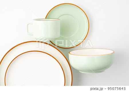 A set of ceramic tableware isolated on white background A set of ceramic tableware isolated on white background 95075643