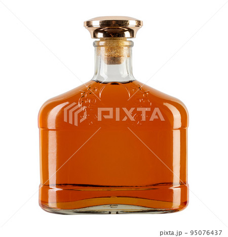 Full bottle of strong alcohol whiskey or cognac isolated on white background. 95076437