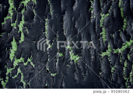 Close-Up of Black Old Cracked Leatherette. Surface Background of Grunge Imitation Leather Chair or Sofa. Show Sponge inside Close-Up of Black Old Cracked Leatherette. Surface Background of Grunge Imitation Leather Chair or Sofa. Show Sponge inside 95080362