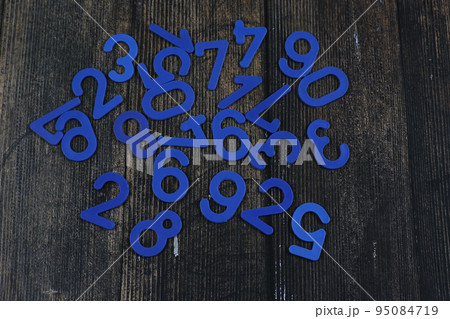 Task in mathematics. Mathematics problem for children. Simple algebra examples using numbers and signs from plastic numbers on a wooden background. Task in mathematics. Mathematics problem for children. Simple algebra examples using numbers and signs from plastic numbers on a wooden background. 95084719