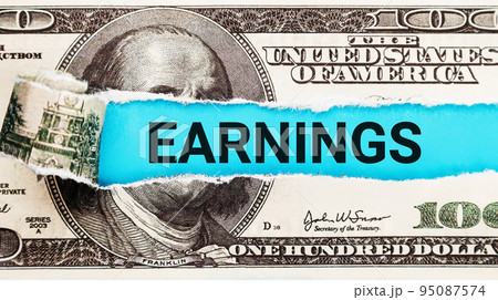 Earnings word written on with American Dollar-bills. The word Earnings on dollar usa background 95087574