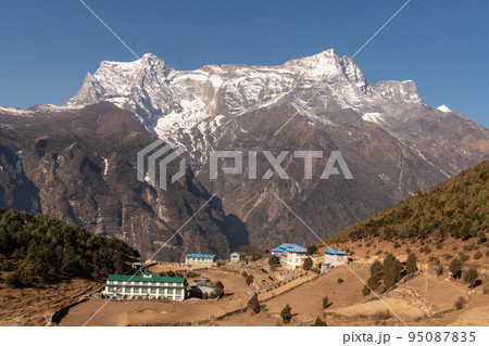 A big mountains with a snow on the blue sky background, Nepal. A big mountains with a snow on the blue sky background, Nepal. 95087835