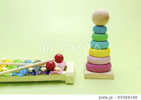 Colorful wooden pyramid and xylophone toy 95088286