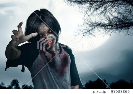 Scary zombie with blood and wound on his body Scary zombie with blood and wound on his body 95088869