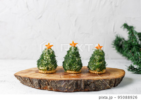 Holiday appetizer in form of christmas tree Holiday appetizer in form of christmas tree 95088926