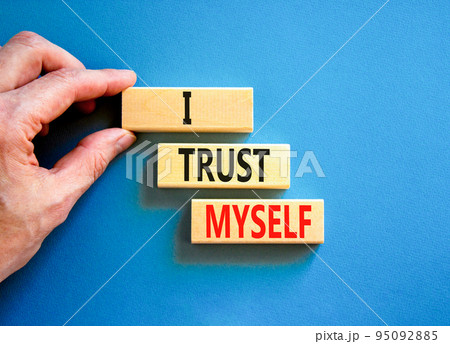 I trust myself symbol. Concept words I trust myself on wooden blocks. Businessman hand. Beautiful blue table blue background. Business, psychological and I trust myself concept. Copy space. I trust myself symbol. Concept words I trust myself on wooden blocks. Businessman hand. Beautiful blue table blue background. Business, psychological and I trust myself concept. Copy space. 95092885