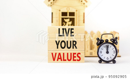 Live your values symbol. Concept words Live your values on wooden blocks. Black alarm clock. Beautiful white table white background. Business, psychological and live your values concept. Copy space. Live your values symbol. Concept words Live your values on wooden blocks. Black alarm clock. Beautiful white table white background. Business, psychological and live your values concept. Copy space. 95092905
