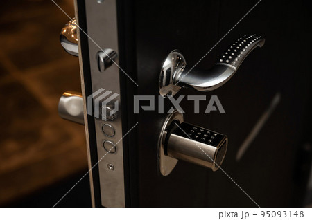 Open door to the apartment with a combination lock. Keyless entry. 95093148