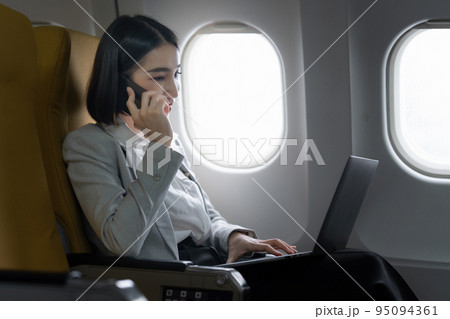 Fund investment woman confirm meeting to client before flight take off. working and travel concept Fund investment woman confirm meeting to client before flight take off. working and travel concept 95094361