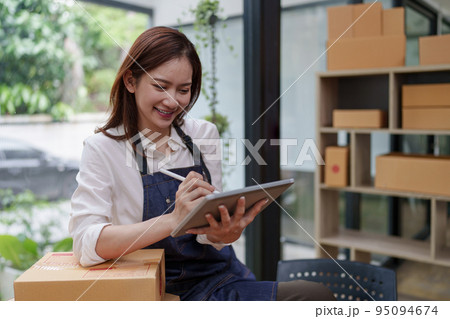 Asian SME business woman working at home office. online shopping concept Asian SME business woman working at home office. online shopping concept 95094674