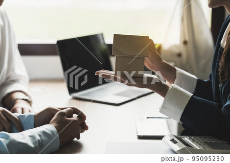 Business woman or Real Estate agent explain signing agreement for buying house. Bank manager and real estate concept 95095230