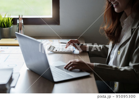 Businesswoman with many financial document to audit budget of company. tax, bill, account concept 95095300