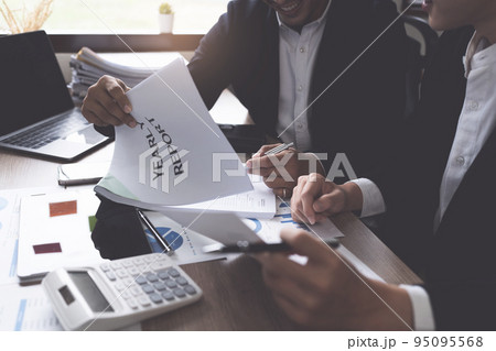 Business People Meeting to discuss and brainstorming the financial report paperwork in home office. Financial advisor teamwork and accounting concept 95095568