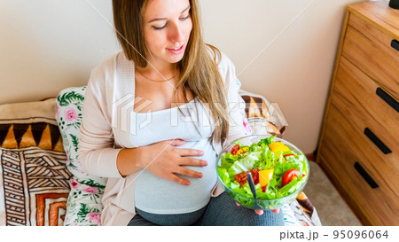 Pregnant healthy food diet. Pregnancy woman eating nutrition diet food salad. Healthy vegetarian food, healthy lifestyle. Pregnant healthy food diet. Pregnancy woman eating nutrition diet food salad. Healthy vegetarian food, healthy lifestyle. 95096064