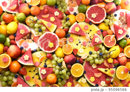 Fresh ripe organic fruits from market: watermelon and orange, grape and lemon, apricot and berries, apple and grapefruit Fresh ripe organic fruits from market: watermelon and orange, grape and lemon, apricot and berries, apple and grapefruit 95096566