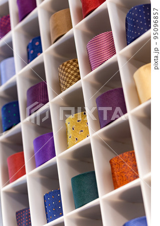 View of different colors ties in showcase. 95096857