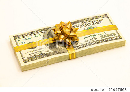 Bundle of dollars with a gift bow. Stack of dollars. US dollar banknotes. A stack of American one hundred dollar bills. Concept of banking business and financial investment money 95097663