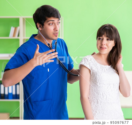 Female patient visiting male doctor in medical concept 95097677