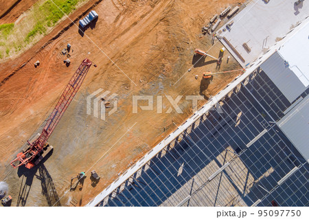 In warehouses of construction site steel framework is being constructed from metal steel In warehouses of construction site steel framework is being constructed from metal steel 95097750