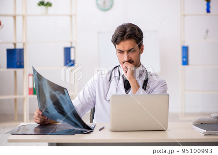 Young male doctor radiologist working in the clinic 95100993