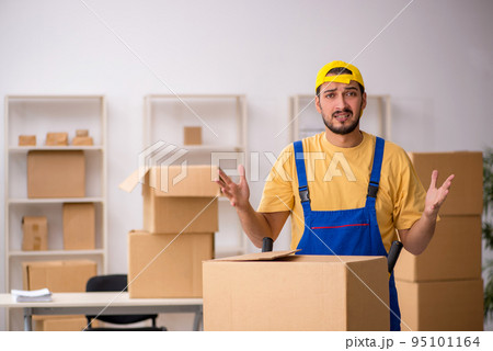 Young male contractor doing home relocation Young male contractor doing home relocation 95101164
