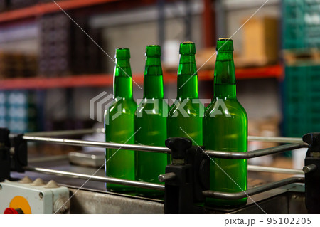 Bottles of cider on bottling line Bottles of cider on bottling line 95102205