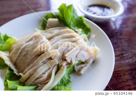 Slice of steamed chicken on plate Slice of steamed chicken on plate 95104146