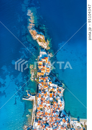 View of Chora town on the beautiful Andros island in Cyclades, Greece, Europe View of Chora town on the beautiful Andros island in Cyclades, Greece, Europe 95104347