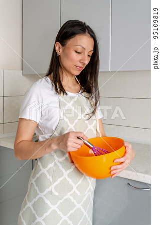 Cooking food process. Chef mixing ingredients in bowl. Cooking food process. Chef mixing ingredients in bowl. 95109819