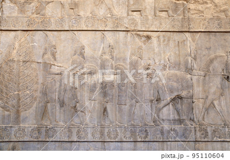 Ancient wall with bas-relief with assyrian foreign ambassadors with gifts and donations, Persepolis, Iran Ancient wall with bas-relief with assyrian foreign ambassadors with gifts and donations, Persepolis, Iran 95110604