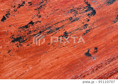 Red painted weathered background 95110707