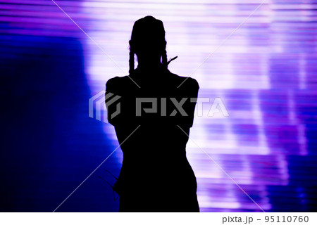 Silhouette of an artist singing live on the stage 95110760