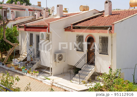 Row of small white houses. Row of small white houses. 95112916