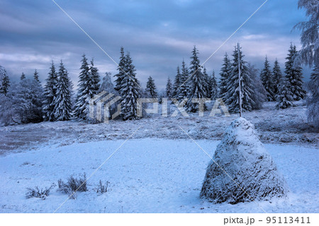 Snow covered haystacks Snow covered haystacks 95113411