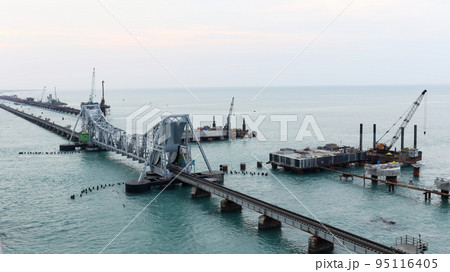 Old Pamban Railway Bridge and new Railway Track under Construction. Opened on 24 February 1914, it was India's first sea bridge, Pamban, Rameswaram, Tamilnadu, India. Old Pamban Railway Bridge and new Railway Track under Construction. Opened on 24 February 1914, it was India's first sea bridge, Pamban, Rameswaram, Tamilnadu, India. 95116405