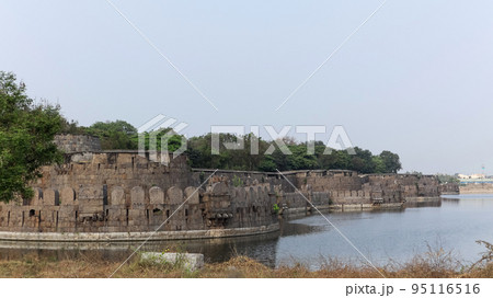Vellore Fort walls and moat. Fort was built by Chinna Bommi Reddy and Thimma Reddy Nayak in 16th Century under the Vijayanagar Empire, Vellore, Tamilnadu, India. Vellore Fort walls and moat. Fort was built by Chinna Bommi Reddy and Thimma Reddy Nayak in 16th Century under the Vijayanagar Empire, Vellore, Tamilnadu, India. 95116516