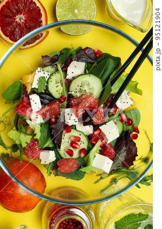 Concept of tasty food, salad with red orange, close up Concept of tasty food, salad with red orange, close up 95121904
