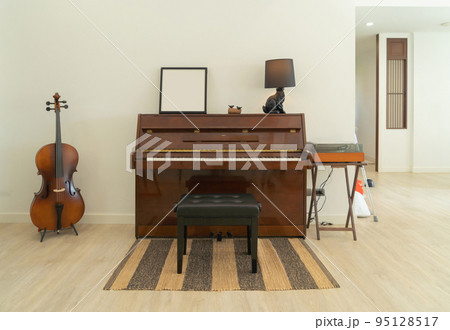 Piano and cello room at home or house for party music performance. Interior design. Entertainment. Celebration event. People lifestyle. Pianist hobby. 95128517
