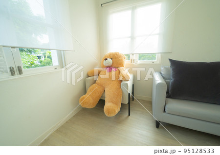 White luxury modern living room with a bear doll. Interior and decoration at home or house, interior design. Lifestyle. 95128533