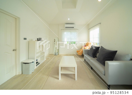 White luxury modern living room with a bear doll. Interior and decoration at home or house, interior design. Lifestyle. 95128534