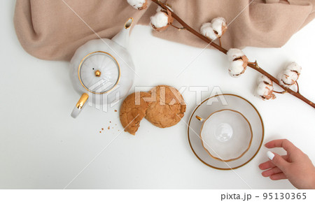 New Year's photo. Kettle and cup on the festive New Year's photo. Kettle and cup on the festive 95130365