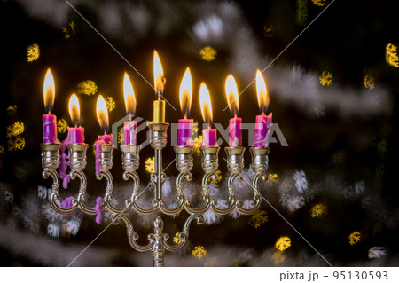 Jewish Religion holiday symbol for Hanukkah in Hanukkiah Menorah burned candles on lit blurred bokeh Jewish Religion holiday symbol for Hanukkah in Hanukkiah Menorah burned candles on lit blurred bokeh 95130593