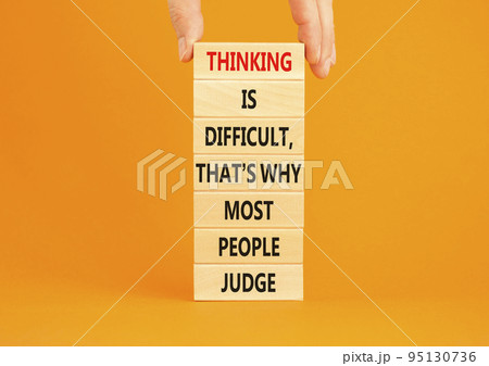 Thinking or judge symbol. Concept words Thinking is difficult that is why most people judge on blocks. Psychologist hand. Beautiful orange background. Business thinking or judge concept. Copy space. Thinking or judge symbol. Concept words Thinking is difficult that is why most people judge on blocks. Psychologist hand. Beautiful orange background. Business thinking or judge concept. Copy space. 95130736