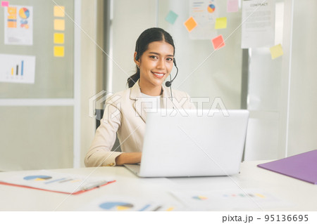 Portrait of young adult call center department business asian entrepreneur woman wearing white suit Portrait of young adult call center department business asian entrepreneur woman wearing white suit 95136695
