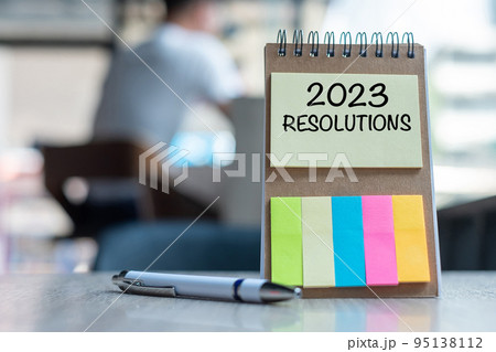 2023 Resolution word on note paper with pen on wooden table. strategy, solution, goal, business, New Year New You and happy holiday concepts 95138112