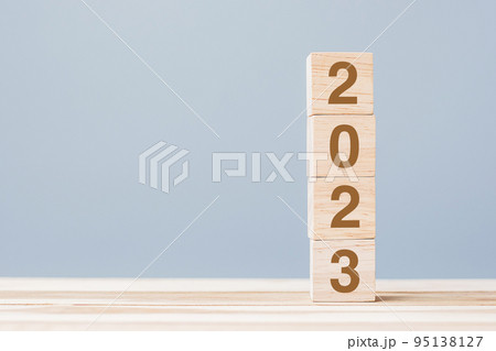 wooden cube block with 2023 text on table background. Resolution, plan, review, goal, start and New Year holiday concepts 95138127